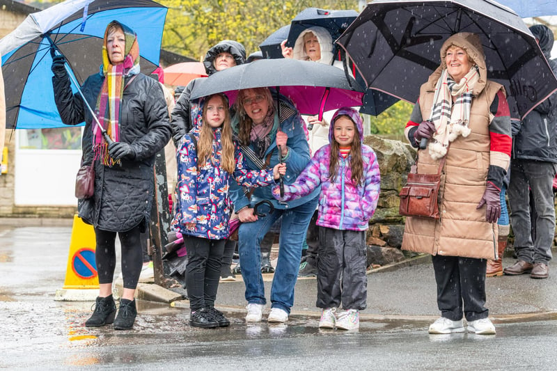 Crowds brave the rain awaiting the arrival of Princess Anne to Trawden. Photo: Kelvin Lister-Stuttard