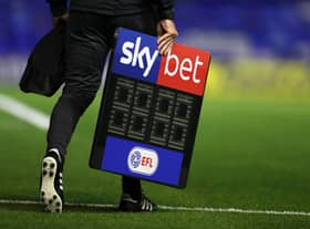 BIRMINGHAM, ENGLAND - SEPTEMBER 18: The fourth official carrys the Sky Bet EFL substitutes board across the pitch ahead of the Sky Bet Championship match between Coventry City and Queens Park Rangers at St Andrew's Trillion Trophy Stadium on September 18, 2020 in Birmingham, England. (Photo by Catherine Ivill/Getty Images)