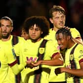 SALFORD, ENGLAND - SEPTEMBER 26: Wilson Odobert of Burnley (R) celebrates with teammates after scoring the team's fourth goal during the Carabao Cup Third Round match between Salford City and Burnley at Peninsula Stadium on September 26, 2023 in Salford, England. (Photo by Michael Regan/Getty Images)