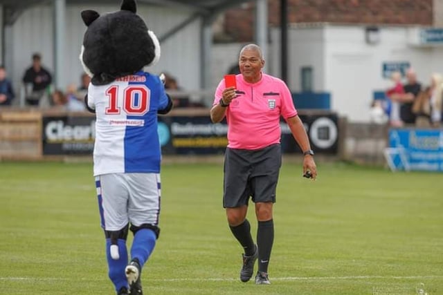 Parkie the Cat mascot is given a red card.