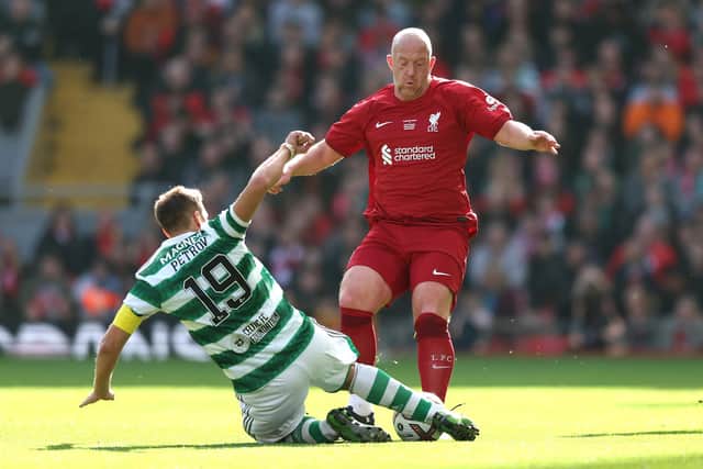 LIVERPOOL, ENGLAND - MARCH 25: Charlie Adam of Liverpool is tackled by Stiliyan Petrov of Celtic during the Legends match between Liverpool and Celtic at Anfield on March 25, 2023 in Liverpool, England. (Photo by Jan Kruger/Getty Images)