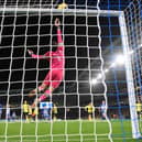 BRIGHTON, ENGLAND - DECEMBER 09: James Trafford of Burnley makes a save during the Premier League match between Brighton & Hove Albion and Burnley FC at American Express Community Stadium on December 09, 2023 in Brighton, England. (Photo by Mike Hewitt/Getty Images)