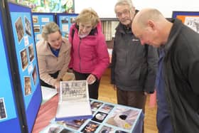 Stephanie Richards (left) explains some of the items on display in Cliviger