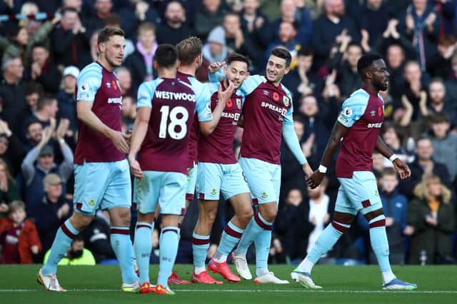 BURNLEY, ENGLAND - OCTOBER 30: Matthew Lowton of Burnley celebrates with teammates after scoring their team's second goal during the Premier League match between Burnley and Brentford at Turf Moor on October 30, 2021 in Burnley, England. (Photo by Jan Kruger/Getty Images)