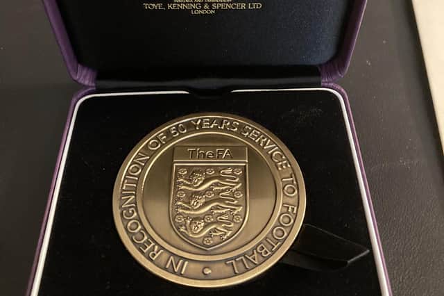 The impressive medal presented to Peter Shaw for 50 years of service to grassroots football