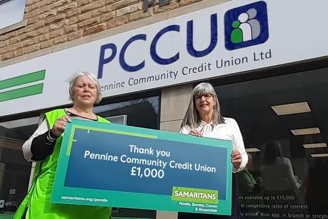 Pauline Hirons (left), Pendle Samaritans’ Treasurer, receiving cheque from Kathryn Fogg, (right) CEO of PCCU