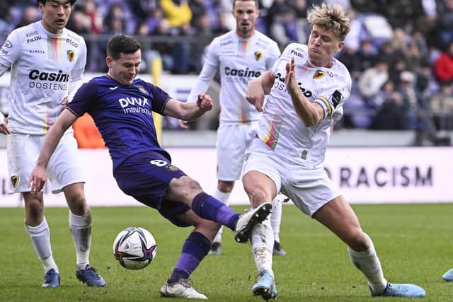 Anderlecht's Josh Cullen and Oostende's Cameron McGeehan fight for the ball during a soccer match between RSC Anderlecht and KV Oostende, Sunday 06 March 2022 in Anderlecht, Brussels, on day 30 of the 2021-2022 'Jupiler Pro League' first division of the Belgian championship. BELGA PHOTO LAURIE DIEFFEMBACQ (Photo by LAURIE DIEFFEMBACQ/BELGA MAG/AFP via Getty Images)