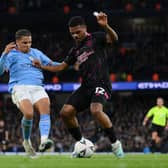 MANCHESTER, ENGLAND - MARCH 18: Lyle Foster of Burnley is challenged by Rico Lewis of Manchester City during the Emirates FA Cup Quarter Final match between Manchester City and Burnley at Etihad Stadium on March 18, 2023 in Manchester, England. (Photo by Michael Regan/Getty Images)