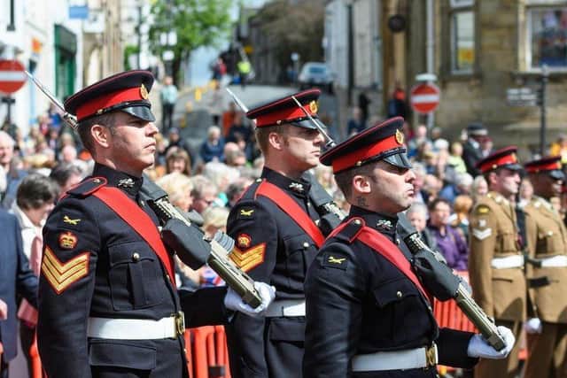 The 1st Battalion of the Duke of Lancaster's Regiment stand to attention during their inspection in Clitheroe