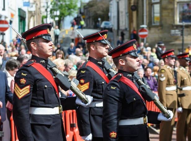 The 1st Battalion of the Duke of Lancaster's Regiment stand to attention during their inspection in Clitheroe