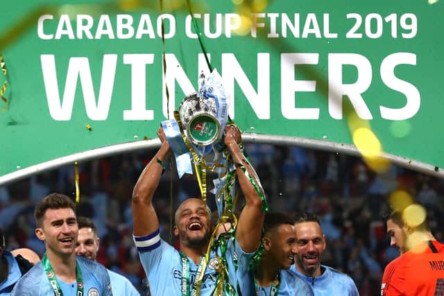 LONDON, ENGLAND - FEBRUARY 24:  Vincent Kompany of Manchester City lifts the trophy after winning the Carabao Cup Final between Chelsea and Manchester City at Wembley Stadium on February 24, 2019 in London, England.  (Photo by Clive Rose/Getty Images)