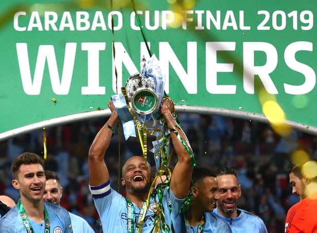 LONDON, ENGLAND - FEBRUARY 24:  Vincent Kompany of Manchester City lifts the trophy after winning the Carabao Cup Final between Chelsea and Manchester City at Wembley Stadium on February 24, 2019 in London, England.  (Photo by Clive Rose/Getty Images)