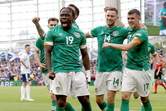 Republic of Ireland's striker Michael Obafemi (C) celebrates with teammates after scoring their third goal during the UEFA Nations League, league B group 1 football match between Republic of Ireland and Scotland at Aviva stadium in Dublin, Ireland on June 11, 2022. (Photo by PAUL FAITH / AFP) (Photo by PAUL FAITH/AFP via Getty Images)