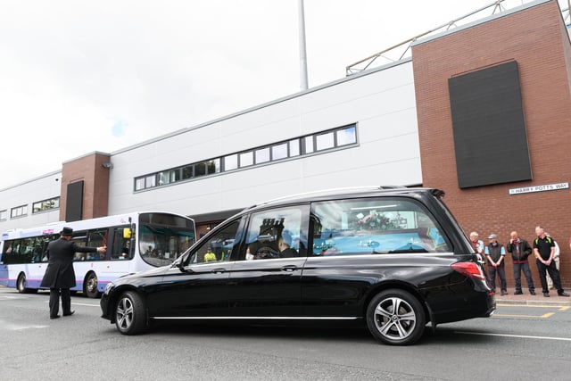 The hearse carrying the coffin of Burnley fan Derek 'Rocky' Mills passes Turf Moor home of his beloved Burnley Football Club. Photo: Kelvin Stuttard