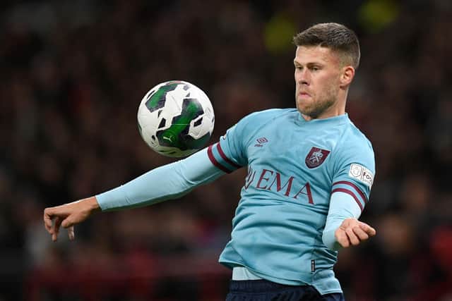Burnley's Icelandic midfielder Johann Berg Gudmundsson controls the ball during the English League Cup fourth round football match between Manchester United and Burnley, at Old Trafford, in Manchester, on December 21, 2022.