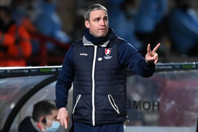 Cheltenham Town's Northern Irish manager Michael Duff gestures on the touchline during the English FA Cup fourth round football match between Cheltenham Town and Manchester City at The Jonny-Rocks Stadium in Cheltenham, central England on January 23, 2021. (Photo by Shaun Botterill / POOL / AFP)
