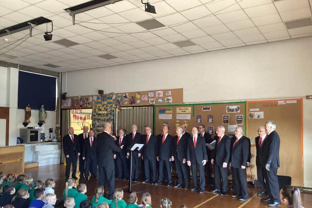 Rossendale Male Voice Choir performing at St Michael and St John's RC Primary School, Clitheroe