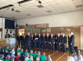 Rossendale Male Voice Choir performing at St Michael and St John's RC Primary School, Clitheroe