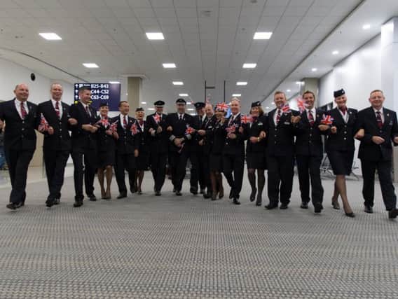BA pilot Ian Walker (centre) with fellow cabin crew who flew the GB paralympians home from Rio