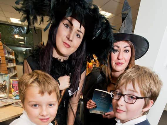 Teachers Rebecca Roach and Parris Dawson act as the witches from Macbeth for Rosewood Primary School pupils Kyle and Jacob Taylor
