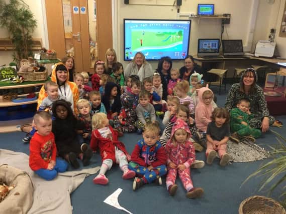 Children and staff at the afternoon session at Whitegate Nursery School in their onesies and pyjamas for the Royal Manchester Children's Hospital.