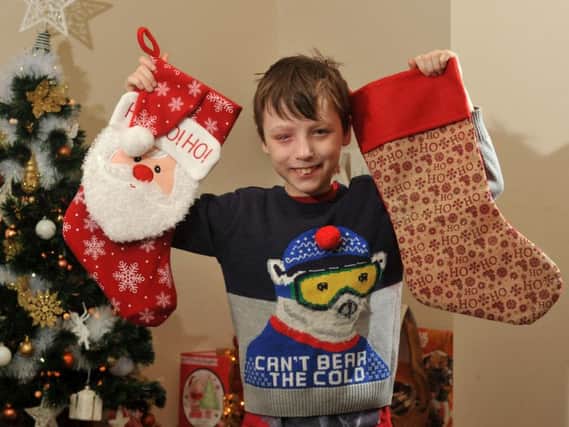 Plucky little firework victim Tyler Norris-Sayers is hoping for extra Christmas treats this year in his stocking.