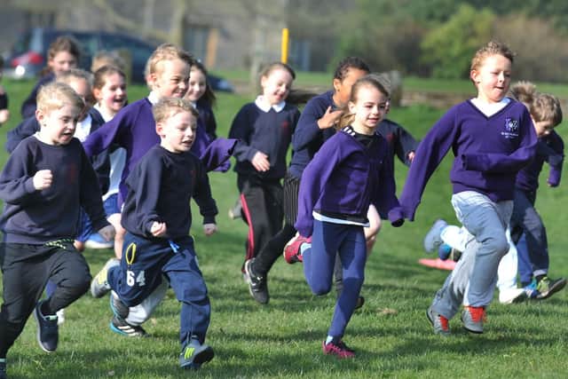The pupils taking part in the Run for Calvary project pictured in full flight during the final fun run at Towneley Park