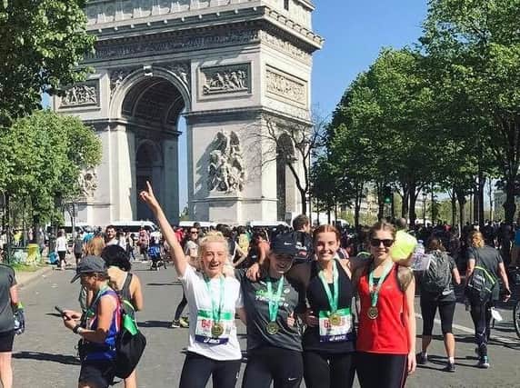 Chloe Giltrow-Shaw (left ) with her friends, Emma Little and Holly and Jennifer Male, after completing the Paris Marathon for pancreatic cancer in memory of Chloe's mum, Paula Helm.
