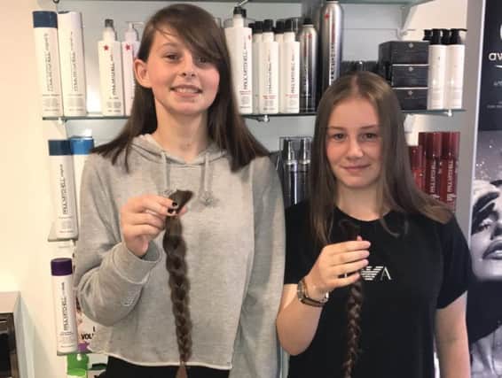 Saffron Kerr (left) and Megan Chapman have donated 28 inches of hair between them to the Little Princess charity.