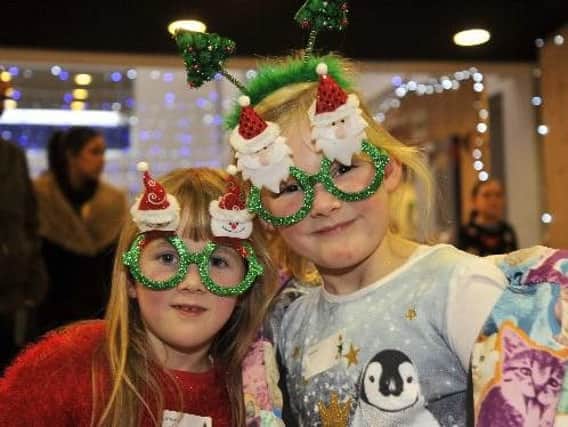 Two young friends enjoy festive fun at last year's Winter Wonderland.