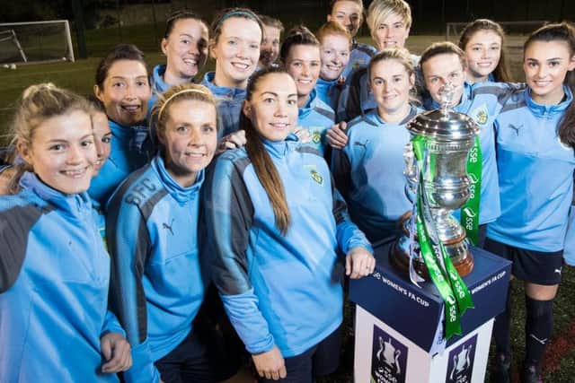 Burnley Ladies show off the FA Cup ahead of their first round tie