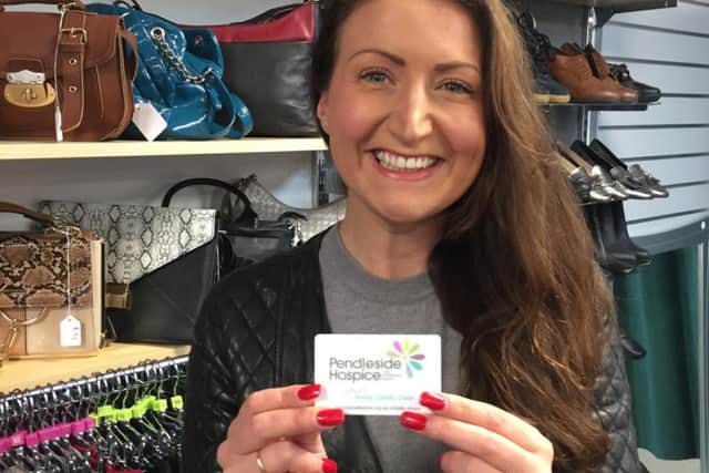 Lyndsey Roche is the first person to become a gift aid donor at the Duke Bar Pendleside Hospice shop.