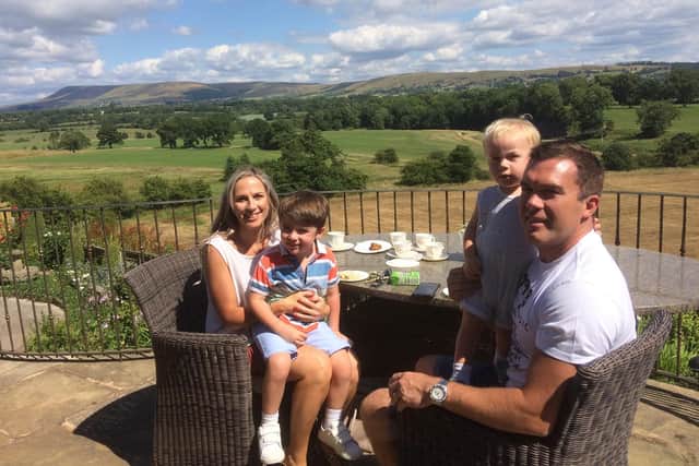 Mark and Natalie Surdival and their sons Harry (four) and one-year-old Niall, who live in Worsthorne, enjoy the views from an elevated verandah at the open garden event at Great Mitton Hall.