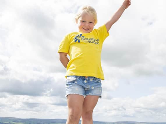 Amazing Daisy Hooper punches the after completing her 52nd walk up Pendle Hill.
