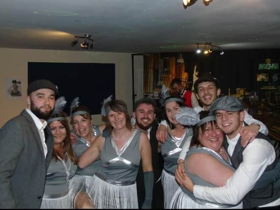Guests have fun at the Peaky Blinders themed night that raised 1,850 for a Burnley primary school.
