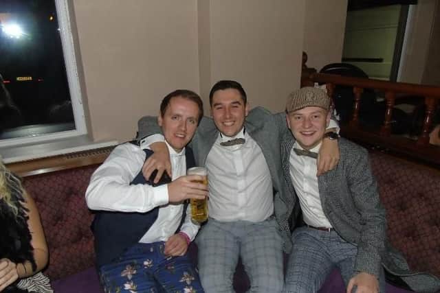 This trio of Peaky Blinders had a great time at the themed charity night.