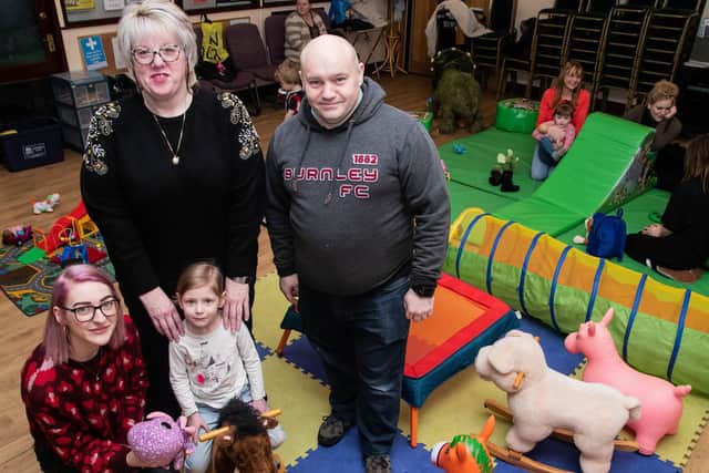 Burnley Wood Community Centre manager Karen Heseltine (back left) with trustee and playgroup organiser Russ Neal and Sasha Smith with her daughter Daisy Hindle (three)