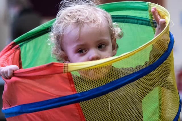 One of the toddlers at the playgroup at Burnley Wood Community Centre enjoys the activities.