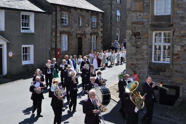 The procession led by Slaidburn Silver Band.