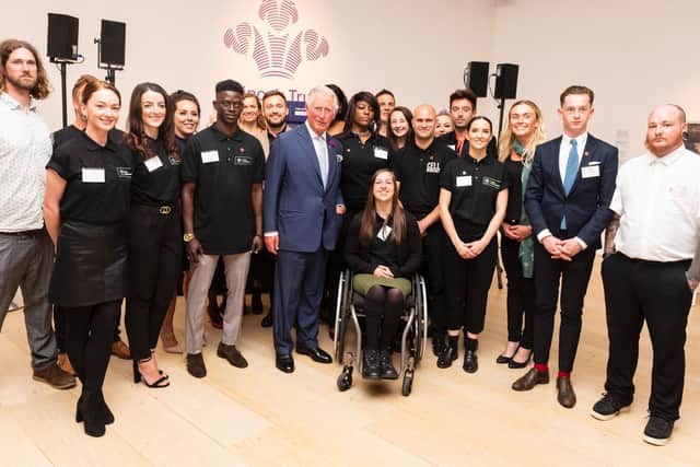 Scott (far right) with Prince Charles and other young entrepreneurs who have been helped by the Prince's Trust.