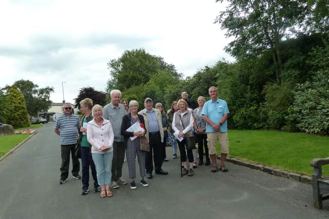 Walkers gather for the guided tour around Burnley Cemetery yesterday.