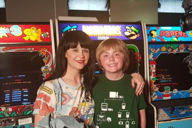 Gemma Taylor and her son Noah Bithell prepare to battle it out at the Arcade Club