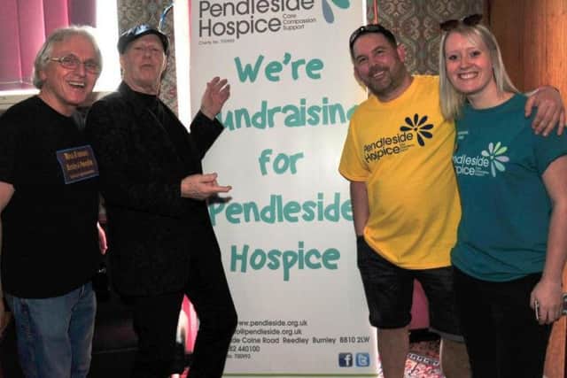 Pendleside Hospice fundraiser Leah Hutchinson is pictured with (from left to right) Phil Schofield of the Bands and Venues facebook page, Bobby Elliott from The Hollies and Brierfield WMC chairman Luke Hamilton.