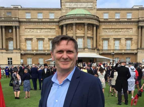 Drama teacher Russell Lane was one of the guests at the Royal garden party at Buckingham Palace.