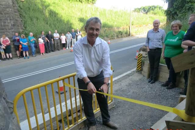 Nigel Evans, Ribble Valley MP, cuts the ribbon marking the opening of another section of the Martholme Viaduct