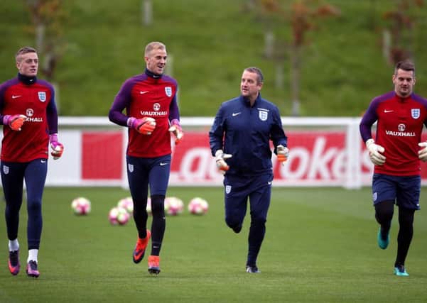 England's goalkeepers (left-right) Jordan Pickford, Joe Hart, coach Martyn Margetson and Tom Heaton during the training session at St George's Park, Burton. PRESS ASSOCIATION Photo. Picture date: Thursday November 10, 2016. See PA story SOCCER England. Photo credit should read: Nick Potts/PA Wire. RESTRICTIONS: Use subject to FA restrictions. Editorial use only. Commercial use only with prior written consent of the FA. No editing except cropping.