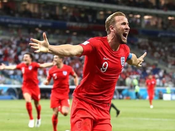 England captain Harry Kane celebrates his second goal to earn the Three Lions victory against Tunisia