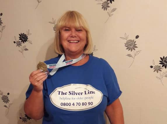 Carole with her medal after conquering Snowdon.
