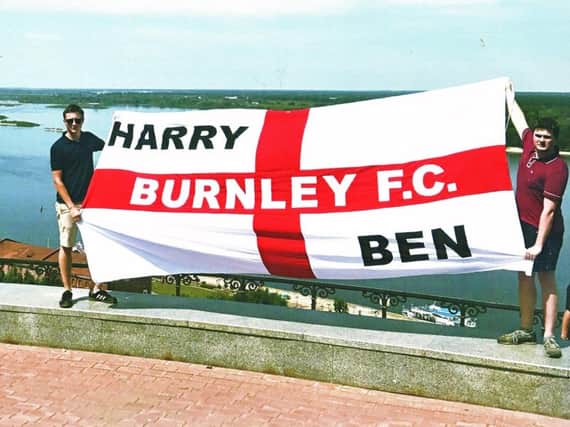 Brothers Harry and Ben Tomlinson with their Burnley FC flag at the World Cup