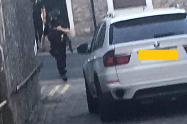 Armed officers are at the scene in Clitheroe